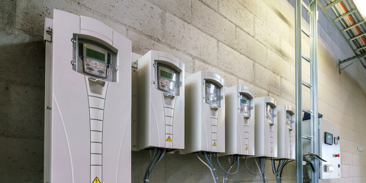 A row of Variable Frequency Drives in a industrial setting